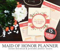 the maid of honor planner printables are on display with flowers and pearls