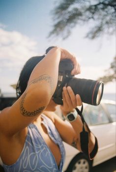 a woman taking a photo with her camera