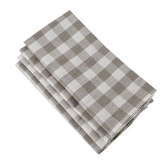 three napkins are folded on top of each other, one has a gray and white checkerboard pattern