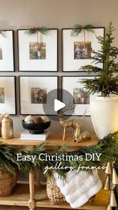 a table with christmas decorations and pictures on the wall