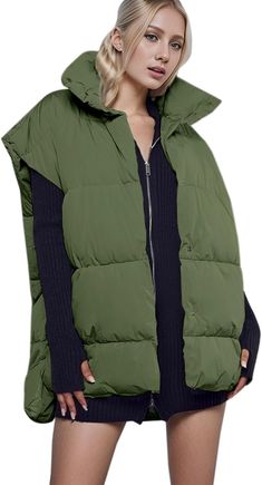 Stay warm on cold winter days with this stylish High Collar Oversized Sleeveless Puffer Vest Winter Coat. The oversized design with a high collar provides an extra layer to keep you warm and comfortable. With lightweight insulation and a puffer design, this coat is perfect for staying cozy during the colder months. The women's winter puffer vest coats made of 100% POLYESTER fabric, smooth and lightweight, wear warm and comfortable. Let you spend a great winter. Sleeveless, solid color, funnel ne Sleeveless Puffer Jacket For Fall, Solid Puffer Vest For Cold Weather, Cold Weather Solid Puffer Vest, Solid Color Puffer Vest For Cold Weather, Sleeveless Puffer Outerwear For Winter, Green Winter Vest For Cold Weather, Oversized Sleeveless Vest For Winter, Casual Oversized Sleeveless Outerwear, Oversized Sleeveless Casual Outerwear