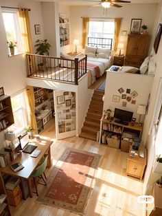 an overhead view of a living room and bedroom with stairs leading up to the second floor