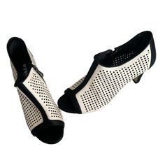 New Perforated Black And White Booties. An All Time Shoe. Wear In Any Season, Summer , Fall Etc. Heel Height 2.75 Size 8.5 Elegant Perforated Heels For Spring, Round Toe Heels With Perforations For Spring, Chic Closed Toe Heels With Perforations, Chic Summer Heels With Perforations, Chic Perforated Heels For Spring, Chic Spring Heels With Perforations, Balenciaga Heels, Navy Blue Pumps, Black And White Heels