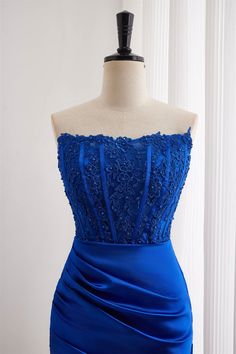 The dress is made of satin in a royal blue color and has a bodycon silhouette. The bodice is adorned with lace applqiues, while the skirt features ruching. The neckline is strapless and the back has a zip-up closure. The length of the dress is above the knee. Item #NP1098 Material: Satin Color: Royal blue Silhouette: Bodycon Embellishment: Lace applqiues bodice, ruched skirt Neck: Strapless Back: Zip-up Length: Above knee length Fully lined: Yes Built-in bra: Yes True to size. Made in China. Dresses are usually packed inside out for protection. Hand wash Blue Silhouette, Tight Homecoming Dress, Ruched Skirt, Satin Color, Royal Blue Color, Wedding Guests, Dress With Lace, Homecoming Dress, Lace Applique