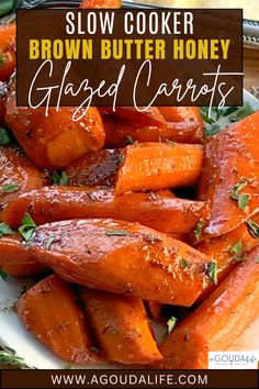 a white plate topped with sliced carrots covered in brown butter