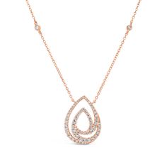 This necklace features a sparkling diamond pendant of teardrops and swoops. Bezel-set diamond stations on a delicate 18K gold cable chain enhance its elegance and shine. -18K gold weighing 4.76 grams -69 round diamonds totaling 0.77 carats Available in yellow, white, and rose gold. Please allow 4-6 weeks for delivery if item is not in stock. Item no. N0210 Diamond Pendant Necklace Elegant, Luxury Fine Jewelry Necklaces With Tension Setting, Luxury Fine Jewelry Necklace With Tension Setting, Luxury Rose Gold Teardrop Necklace, Luxury Engraved Teardrop Necklace, Luxury Teardrop Jewelry With Tension Setting, Luxury Teardrop Pendant Necklace With Diamond Accents, Luxury Teardrop Pendant Necklaces With Cable Chain, Luxury Tension Setting Diamond Necklace For Engagement