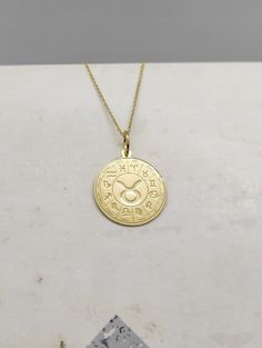 WE SHIP ALL PARCELS IN ONE BUSINESS DAY FOR FREE AND PROVIDE THE SPEEDIEST DELIVERY! Engraved Taurus Design Necklace - Astrology Pendant Necklace - Handmade Taurus Gold Jewelry - Engraved Taurus Gold Necklace Engraved Taurus Pendant Necklace made out of 14K Solid Gold. Available only in Yellow Gold finish. An elegant piece of jewelry that is a perfect gift to yourself and your loved ones. Charm Thickness: 0.5mm Jump Ring inner diameter: 4mm Add your engraved personalization at the back of the pe Yellow Gold Zodiac Sign Amulet Necklace, Yellow Gold Zodiac Amulet Necklace, 14k Gold Zodiac Sign Necklace With Round Pendant, Symbolic Yellow Gold Zodiac Jewelry, Symbolic Yellow Gold Jewelry With Zodiac Sign, Yellow Gold Zodiac Sign Jewelry, Yellow Gold Zodiac Sign Necklace For Anniversary, Anniversary Zodiac Sign Necklace In Yellow Gold, Anniversary Zodiac Sign Yellow Gold Necklace