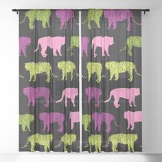 a curtain with different colored tiger silhouettes on grey and pink curtains in front of a window