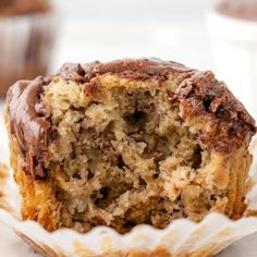 a close up of a muffin with chocolate frosting