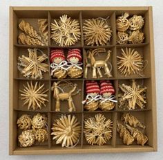 an open cardboard box filled with christmas ornaments