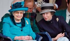 two women sitting next to each other wearing hats