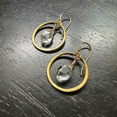 These hoops are made with GOLD VERMEIL! (Vermeil is a premier version of a thick electro-plating of 23.5 karat gold over a solid sterling silver base- it's the right solution for us to provide everyone who wants their JK pieces in GOLD that are durable, beautiful and affordable!) Each hoop has Herkimer Diamonds wired into their centers. These are light and dreamy and a bit fancy! Herkimer Diamonds are a type of quartz found in Herkimer, New York. It was discovered in the 18th century when workmen were cutting stone in the Mohawk River Valley and is estimated to be over 500 million years old. It is used to enhance and amplify your spiritual energy while also ascending you to your highest spiritual vibration. Herkimer Diamond has become commonly referred to as “The Stone of Attunement”. Its Hammered Gold Sterling Silver Hoop Earrings, Gold Hammered Small Hoop Jewelry, Small Hoop Hammered Gold Jewelry, Gold Hammered Oval Hoop Earrings, Gold Oval Hammered Hoop Earrings, Small Hammered Gold Hoop Jewelry, Gold Earrings Of Recycled Gold For Anniversary, Handmade Gold Oval Hoop Earrings, Handmade Oval Gold Hoop Earrings