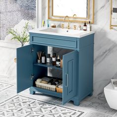 a bathroom with a blue cabinet and sink