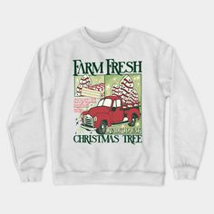 a white sweatshirt with an image of a red truck on the front and words farm fresh christmas tree