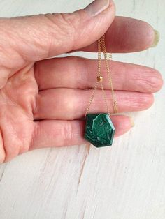 A vibrant and edgy semi raw malachite drop hangs from a 14k gold filled chain. The gold bead in center allows you to adjust your pendant to shorter or longer length.See LAPIS design of this necklace here: https://www.etsy.com/listing/542796254/lapis-necklace-lapis-jewelry-lapis?ref=shop_home_active_1Stone sizes range between 1/2 -1 inch.Length of necklace range from 16 inches- 22 inches.MATERIAL:GOLD-FILLED - 14k Gold filled is considerably durable and considered a lifetime piece of jewelry. Thi Handmade Gold Malachite Necklaces, Handmade Gold Necklaces With Malachite, Handmade Gold Necklace With Malachite, Green Malachite Necklace For Gift, Unique Malachite Necklace Gift, Gold Malachite Necklace As Gift, Malachite Pendant Necklace As Gift, Malachite Gemstone Necklace For Gift, Malachite Pendant Necklace For Gift