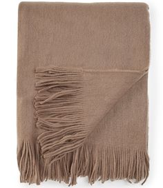 a brown blanket with fringes on it