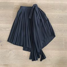 New With Tags Maje Black Skirt. Chic Asymmetrical Pleated Wrap Skirt, Black Asymmetrical Pleated Skirt, Chic Fitted Pleated Wrap Skirt, Asymmetrical Pleated Black Skirt, Black Pleated Asymmetrical Skirt, Black Asymmetrical Pleated Skirt For Evening, Black Asymmetrical Pleated Skirt For Spring, Chic Black Asymmetrical Wrap Skirt, Chic Black Lined Wrap Skirt