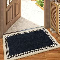 an open door with a black and white checkered rug