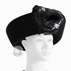 "Preowned, vintage Breton style hat, made by milliner Mr. John, most likely in the 60s. Made from black felt wool, it features a wide upturned brim and an embellished bow at the front.    A fabulous, high fashion hat that's perfect for your events and holiday parties! So easy to style and wear, it's the perfect accent for formal wear!   Made in the USA.  Tagged Mr. John Classic New York Paris. No size tag. Approximate measurements: interior crown = 22in; brim height = 4in. Fits like a modern siz Black Top Hat For Evening With Structured Crown, Black Structured Crown Top Hat For Evening, Black High Crown Hat For Evening, Fitted Wool Party Hat, Elegant Black High Crown Felt Hat, Black Wide Brim Headpiece For Evening, Evening Wool Hats, Vintage Curved Brim Felt Hat For Evening, Vintage Felt Hat With Curved Brim For Evening