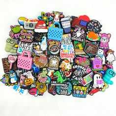 a pile of different colored and shaped stickers