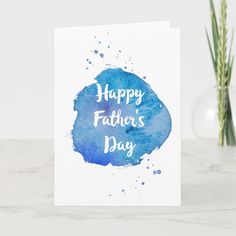 a card with the words happy father's day written in blue ink on it