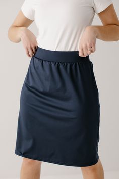 Looking for modest options to accompany your active lifestyle? We have you covered with our modest athletic skort! Our high quality, athletic skorts are cut and sewn right here in Lancaster County, Pennsylvania and have withstood even the most rigorous activities. With fitted knee length shorts sewn in at the elastic waistband, this skort will soon become your go to piece for your favorite sport or activity! Choose from several shades and stripe or no stripe! Made with a moisture-resistant, medi Navy Stretch Activewear With Elastic Waistband, Athleisure Solid Swim Skirt With Elastic Waistband, Navy Stretch Casual Skort, Short Sew In, Modest Clothing Women, Lancaster County Pennsylvania, Modest Girl, Athletic Skirts, Athletic Skort