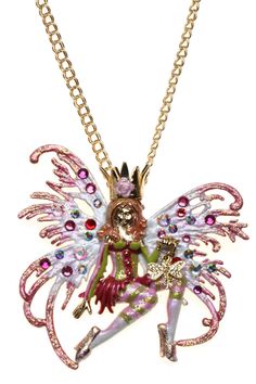 a necklace with an image of a fairy on it