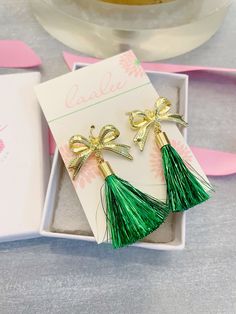 Beautiful gold ribbon earrings with a green tinsel tassel measuring approximately 2.5-3". These are great for St. Patrick's jewelry, gifts for her, preppy jewelry, classy jewelry! Giftbox included. Green Tassel Earrings For Party, Elegant Green Earrings For Christmas, Green Drop Tassel Earrings For Party, Green Tassel Drop Earrings For Party, Green Tassel Earrings As Gift, Elegant Green Dangle Tassel Earrings, Green Earrings New Year Gift, Gold Tassel Drop Earrings For Gifts, Green Earrings For New Year Gift