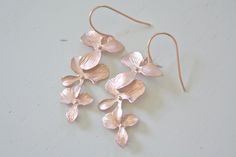 "Rose Gold Earrings, Orchid Earrings Dangle Earrings Rose Gold Jewelry Bridesmaid Gifts Bridesmaid Jewelry Birthday Gift Best Selling Items ♥Simple, everyday matte rose gold plated orchid earrings ♥Drop is approx. 1.5\" from top of ear wire ♥Here's a review from one of my customers...So impressed with the quality of these earrings - they are really dainty, delicate and absolutely beautiful! Better than expected! Beautiful quality and detail in the piece! Thank you! ♥FINISH - Available in ROSE GO Nickel Free Rose Gold Flower Earrings For Wedding, Nickel-free Rose Gold Flower Earrings For Wedding, Delicate Rose Gold Earrings For Bridesmaid Gift, Orchid Earrings, Gold Orchid, Gifts Bridesmaid, Earrings Rose Gold, Jewelry Bridesmaid, Earrings Dainty