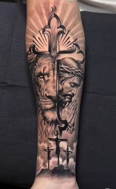 a man's arm with a cross and lion on it