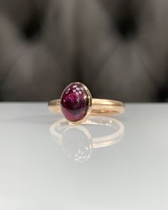 Natural Rhodolite Garnet Ring * Dainty Cabachon Ring * Genuine Garnet & 14K Solid Gold * Best Gift for Her/Him * Handmade Ring ◎ Details ◎ ○ Gemstone Details .Natural RHODOLITE GARNET Oval Cut 9X7 mm approx. 2.11 ct ○ Gold Details 14K Solid Gold Width of Band : 2.50 mm Weight of Ring : approx 3.80 gr Made to Order HANDMADE ITEM ○ Upgrade to Solid 18K Gold, please click the link below: https://www.etsy.com/listing/962826004 For more CABACHON BEZEL rings : http://etsy.me/37fvI60 All of our jew Timeless Cabochon Sapphire Ring, Formal 14k Gold Sapphire Ring With Oval Cabochon, Classic Yellow Gold Sapphire Ring Oval Cabochon, Classic Oval Cabochon Rings Stamped 14k, Classic Yellow Gold Sapphire Ring With Cabochon, Classic Sapphire Ring Oval Cabochon, 14k Gold Domed Signet Ring With Gemstone, Timeless Gift Sapphire Cabochon Ring, Classic 14k Gold Sapphire Oval Cabochon Ring