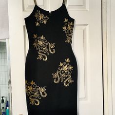 Limited Black Dress With Gold Beaded Embellishments Never Worn Elegant Black Embellished Bodycon Dress, Black Fitted Embellished Dress, Fitted Black Embellished Dress, Embellished Black Bodycon Evening Dress, Black Embellished Midi Evening Dress, Black Sleeveless Embellished Bodycon Dress, Sleeveless Black Embellished Bodycon Dress, Fitted Embellished Midi Dress For Dinner, Elegant Black Bodycon Dress