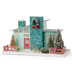 a christmas scene with a house and trees