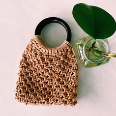 This is a unique, handmade macrame handbag/clutch. This bag will complement and add flair to any summer outfit.The hand bag is made with high quality 100% natural cotton single strand rope (3 mm size). It is made with natural wood handles. The bag measurements are:Height with handles - 10 inches Height without handles - 7 inchesLength - 7 inchesHandles measure 4 inch circumference Please let me know if you would like this design in a different color or size, and I would be happy to discuss doing Macrame Handbag, Wood Handles, Bag Measurements, Boho Bags, Handmade Macrame, Wood Handle, Wooden Handles, Clutch Handbag, Hand Bag