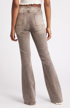 These faded jeans add leg-lengthening style to everyday looks with raised front pintucks and a low rise that updates a '70s-inspired flare. 33 1/2" inseam; 22" leg opening; 9 1/2" front rise; 15 1/2" back rise (size 29) Zip fly with button closure 66% cotton, 29% polyester, 3% viscose, 2% spandex Machine wash, tumble dry Imported Soft-washed Wide Leg Bottoms For Fall, Soft-washed Wide Leg Pants For Spring, Fall Soft-washed Wide Leg Bottoms, Mid-rise Washed Bottoms For Fall, Mid-rise Washed Pants For Fall, Casual Medium Wash Flares For Fall, Trendy Washed Bottoms For Fall, Spring Stretch Soft-washed Bottoms, Mid-rise Medium Wash Flares For Fall