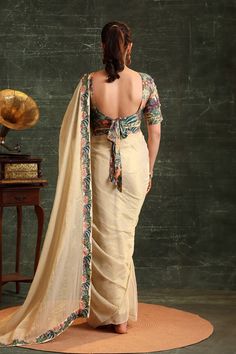 Beige pre-stitched saree with floral print on border. Paired with printed and cutdana, sequin embroidered padded blouse. - Aza Fashions Elegant Fitted Pre-draped Saree For Transitional Season, Fitted Cotton Silk Pre-draped Saree For Wedding, Fitted Cotton Silk Pre-draped Saree, Fitted Chanderi Pre-draped Saree With Zari Work, Fitted Art Silk Pre-draped Saree With Zari Work, Fitted Art Silk Pre-draped Saree For Designer Wear, Elegant Embroidered Draped Saree, Embroidered Fitted Draped Saree, Embroidered Fitted Saree