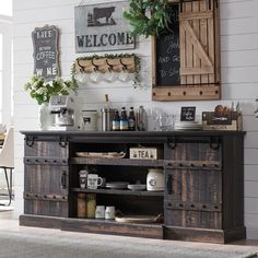 an old fashioned buffet table is decorated with vintage signs and other items for the dining room