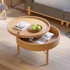 a coffee table with two trays on it and some fruit in the bowl next to it