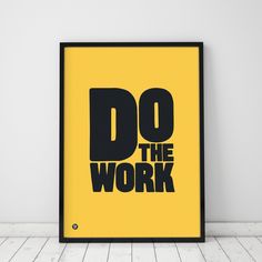 a framed poster with the words do the work on it in black and yellow colors