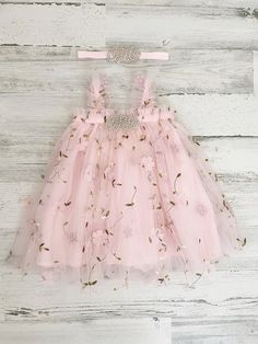 This listing if for a pink floral pastel tutu dress!  Perfect for that 1st birthday!!  *This dress comes as is (with no "one")- "Dress only" option from the drop down menu Dress with one (just the one dress) One Dress with headband   ~headband elastic can be made in any color! ~ ships within 1 to 3 business days (message me with any additional questions)! ~ headband backed with felt for comfort {{SIZING}}  6-9 months (fits 18-20 lbs.) 9-12 months (fits 20-22 lbs.) 12-18  months  (fits 22-26 lbs. Whimsical Pink Tutu Dress For Summer, Cute Pink Princess Dress With Floral Applique, Whimsical Pink Dress With Floral Applique, Pink Princess Tutu Dress For Spring, Princess Tutu Dress With Floral Applique For Birthday, Princess Style Tutu Dress With Floral Applique For Birthday, Pink Tutu Dress With Floral Applique For Summer, Pink Princess Dress With Floral Applique For Summer, Whimsical Pink Princess Dress With Floral Applique