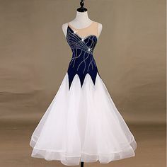 a white and blue dress on a mannequin