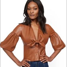 Ny&C Faux Leather Corset Top Cigar Brown V-Neck With Tie Detail. 3/4-Length Balloon Sleeves With Elastic Cuffs. Corset Detail At Waist. Hits At Hip New With Tags Spring Party Faux Leather Tops, Spring Faux Leather Tops For Night Out, Trendy Leather Tops For Spring, Faux Leather Tops For Work In Spring, Faux Leather Tops For Spring Workwear, Faux Leather Top For Work In Spring, Top Cigars, Leather Corset Top, White Dress Top