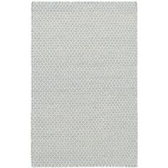 a white and grey rug with small circles on the bottom, in front of a white background