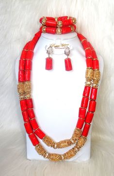 Traditional Real Coral 2 layer African Nigerian Beads Party Wedding Jewelry set Complete Set is Necklace Earring and bracelet Wedding Party Bridal Special Occasion This detailed Jewellery set makes you stand out elegantly in any special occassion, it's all about glamour and uniqueness.  Buying more that 1 Jewellery set, we offer wholesale and bulk prices for all our jewellery. Red Round Beaded Bracelets For Wedding, Red Beaded Bracelets With Round Beads For Wedding, Elegant Bridal Necklace With Large Beads For Party, Elegant Beaded Bracelets With Large Beads For Wedding, Traditional Large Beads Jewelry For Party, Red Spacer Beads Jewelry For Wedding, Adjustable Wedding Jewelry With Faceted Beads, Adjustable Large Beads For Weddings, Gold Beaded Bracelets For Wedding With Large Beads