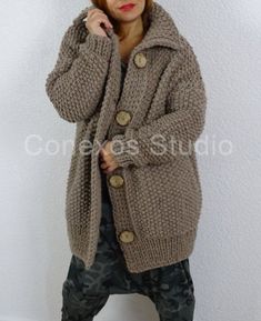 Bulky knit comfy casual oversized long cardigan.Very soft, warm, cozy and pleasant for skin.Easy to clean and practical to wear. Suitable to any outfit for different occasions.Practical and convenient.Great addition to your everyday clothing.Color: Beige (619)Material: 65% Wool, 35% AlpacaA soft and chunky blend of alpaca and wool MADE TO ORDER!!!It takes 3-4 weeks before item is made and ready to ship!Measurements:length 75 cm (29.5 '')width 60 cm (23.6 '')*** In picture knitted product is demo Trendy Hand Knitted Outerwear For Winter, Trendy Hand Knitted Winter Outerwear, Trendy Winter Hand Knitted Outerwear, Trendy Hand Knitted Outerwear For Fall, Bohemian Chunky Knit Long Sleeve Outerwear, Trendy Oversized Knitted Outerwear, Casual Oversized Hand Knitted Outerwear, Oversized Knitted Outerwear, Oversized Hand Knitted Sweater Coat For Fall