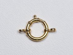 ♥ This is a 14k gold circular-shaped charm enhancer with a spring ring clicking mechanism for closure ♥ This clasp can be used to connect two chains with large loops or used as a clasp for a necklace ♥ Can open and connect two chains together, and string multiple charm or pendants together on one clasp ♥ The necklace chain is *NOT INCLUDED*. You can purchase the solid 14K gold chain as an option, or use one of your existing chains for the pendant. ♥ AD2392-13: ~13mm measured on the outside, 2mm Charm Holder, Tourmaline Pendant, Gold Circle, Unique Wedding Bands, Necklace Charm, Pearl Strands, Circle Pendant, Necklace Chain, Spring Rings