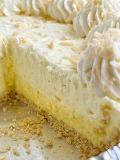 a close up of a pie with white frosting