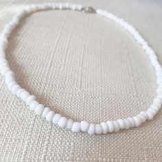 This white seed-beaded choker is super cute to add a pop of color to any outfit or to go with any occasion! Its made with beading wire (non-stretchy). The standard choker length is 15 inches long. If you message me on Instagram or Etsy I can make the choker smaller or bigger to fit you. For best care stay away from water! Size: 15 inches long Things included in your package (bubble mailer) : -your order -thank you card -extras (stickers or candy) Make sure you follow my Instagram @jewelrybynausheen for amazing jewelry posts and shop updates! Minimalist White Choker For Everyday, Minimalist White Everyday Choker, Everyday Minimalist White Choker, Everyday White Beaded Necklaces, Everyday White Single Strand Beaded Necklace, Trendy White Necklace For Everyday, Everyday Adjustable White Necklaces, Everyday Adjustable White Necklace, Trendy White Everyday Necklace