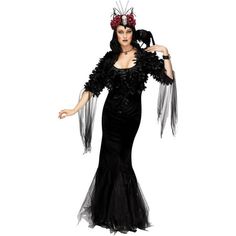 a woman in a black dress and headpiece is posing for the camera with her hands on her hips