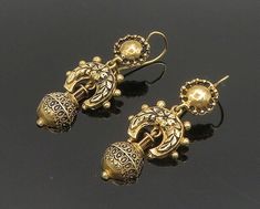 14K GOLD - Vintage Shiny Victorian Floral Detail Dangle Earrings - GE016  14K GOLD - Vintage Shiny Victorian Floral Detail Dangle Earrings - GE016  Jewelry Type:         Earrings   Metal Type:            14K Gold   Metal Size:             1 1/2"   Stone Type:            N/A  Condition:              N/A  Jewelry Weight:     8.3 Grams  PLEASE NOTE: THIS ITEM IS PRE-OWNED. ALTHOUGH MOST ITEMS ARE IN VERY GOOD CONDITION, SOME MAY NEED CLEANING AND/OR MINOR REPAIRS. WE MAKE A VERY STRONG EFFORT TO UP Antique Gold Earrings With Latkans, Formal Gold Pierced Danglers, Ornate Gold Danglers For Formal Occasions, Vintage Gold Earrings For Celebration, Antique Gold Jewelry With Latkans, Vintage Gold Celebration Earrings, Gold Vintage Danglers For Festive Occasions, Vintage Gold Danglers For Festive Occasions, Vintage Gold Pierced Danglers